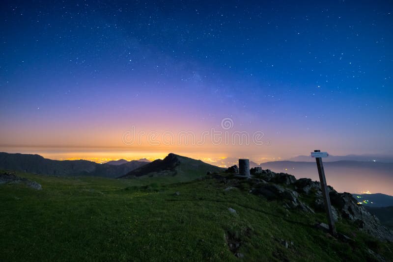 The wonderful starry sky over Torino Turin, Italy from the majestic mountain range of the Italian Alps, with glowing lights of t