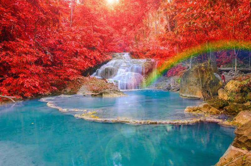 Wonderful Waterfall with rainbows in deep forest at national park