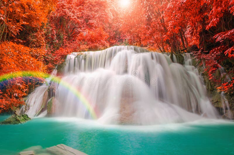 Wonderful Waterfall with rainbows in deep forest at national park