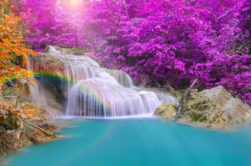 Wonderful Waterfall with rainbows in deep forest at national park