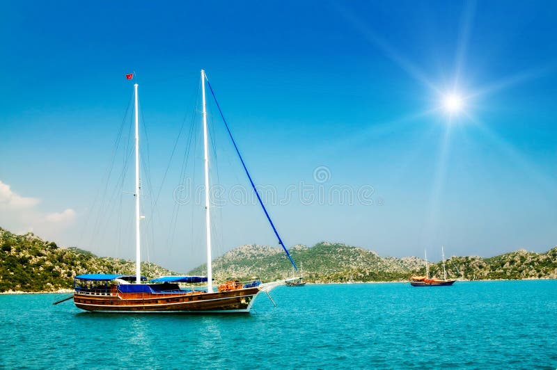 Wonderful yachts in the bay and sunbeams.