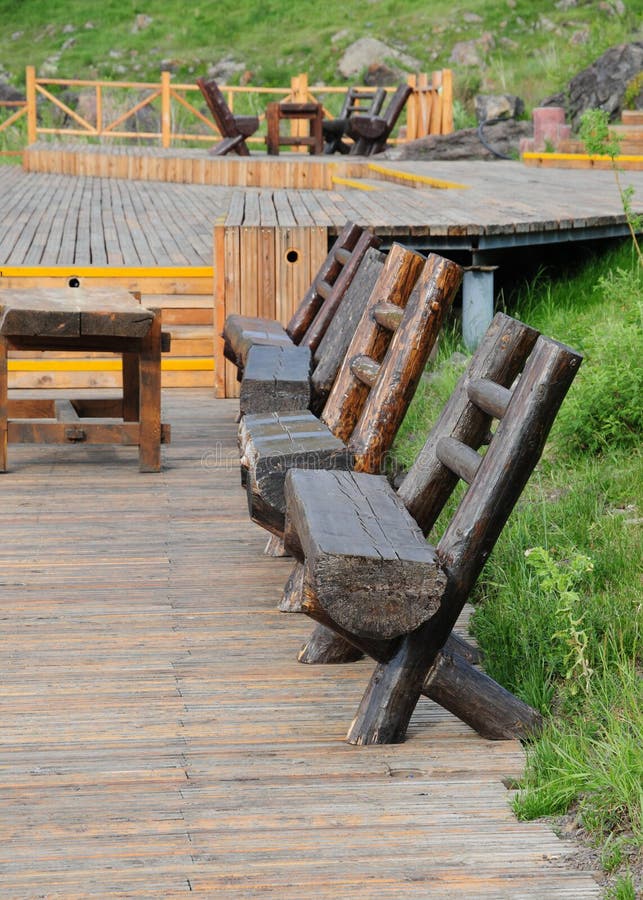 The wood bench on pavement board