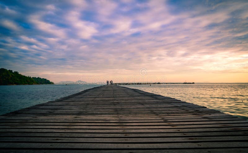 Wood bridge pier with beautiful sunrise sky and clouds stock photos Wood bridge pier with beautiful sunrise sky and clouds stock photos