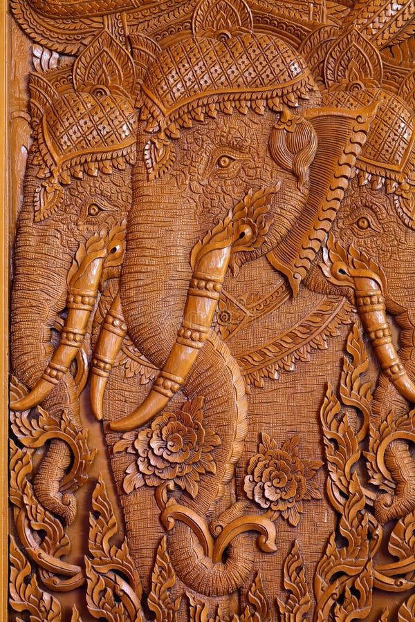 Wood carving pattern on the door of Thai temple.