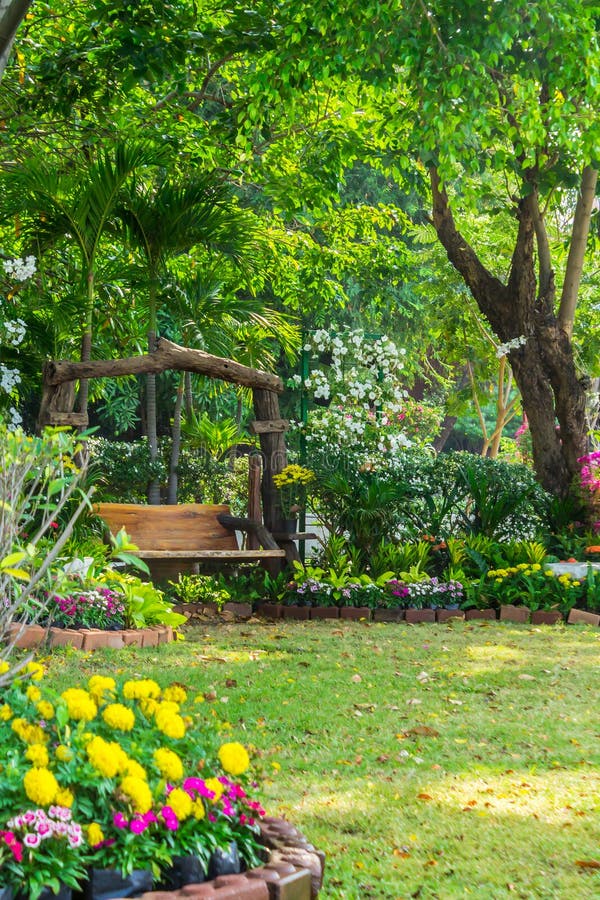 Wood Chair in the Flowers Garden. Stock Photo - Image of decoration ...