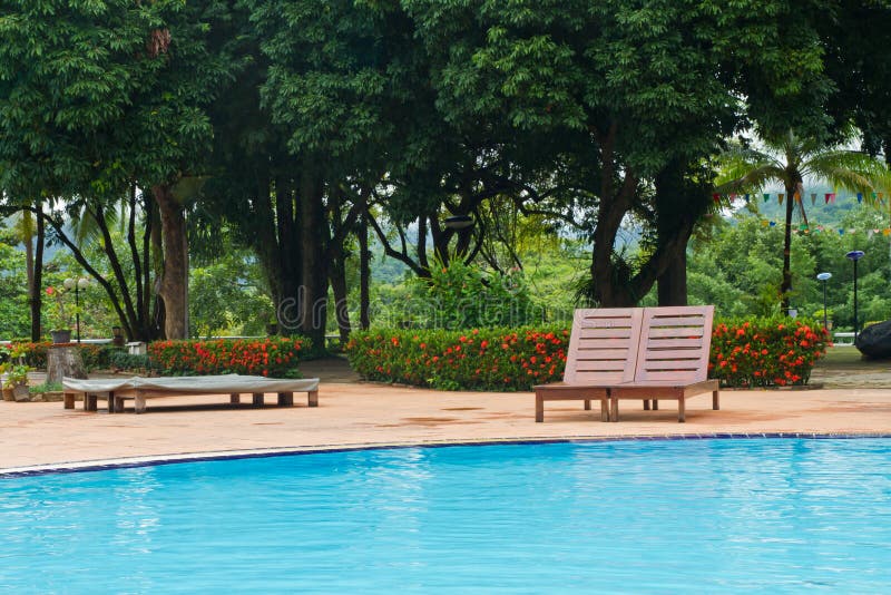 Wood chairs on pool deck