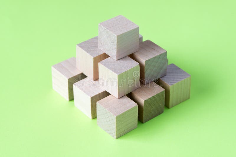 Wood cubes arranged in pattern geometric royalty free stock images