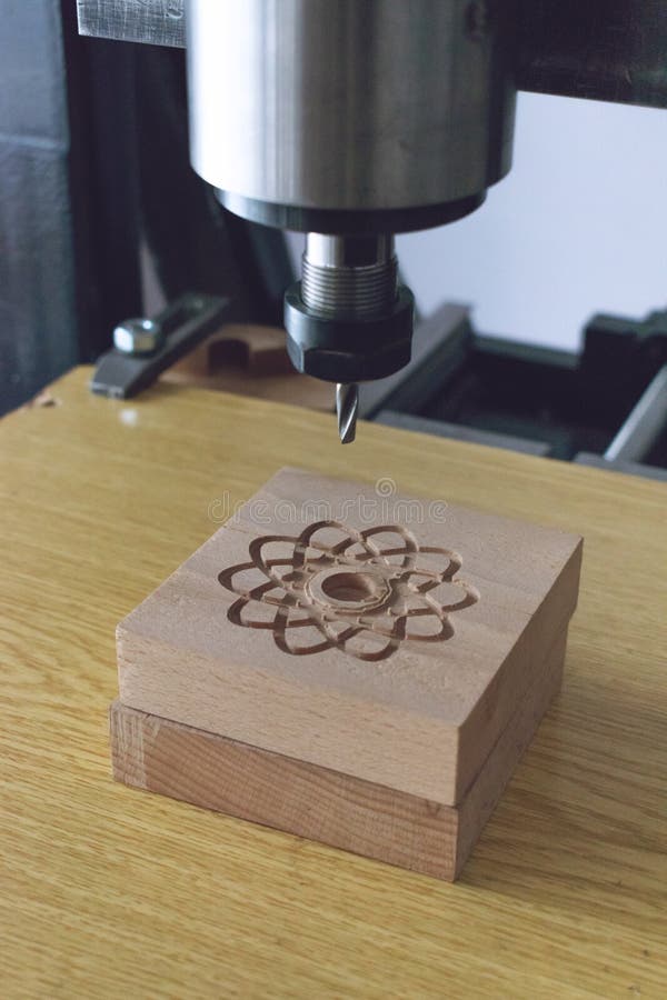 Wood cutting machine 3D wood cnc router. CNC milling machine carving a wooden part blank. Cutter controlled by computer while he royalty free stock images