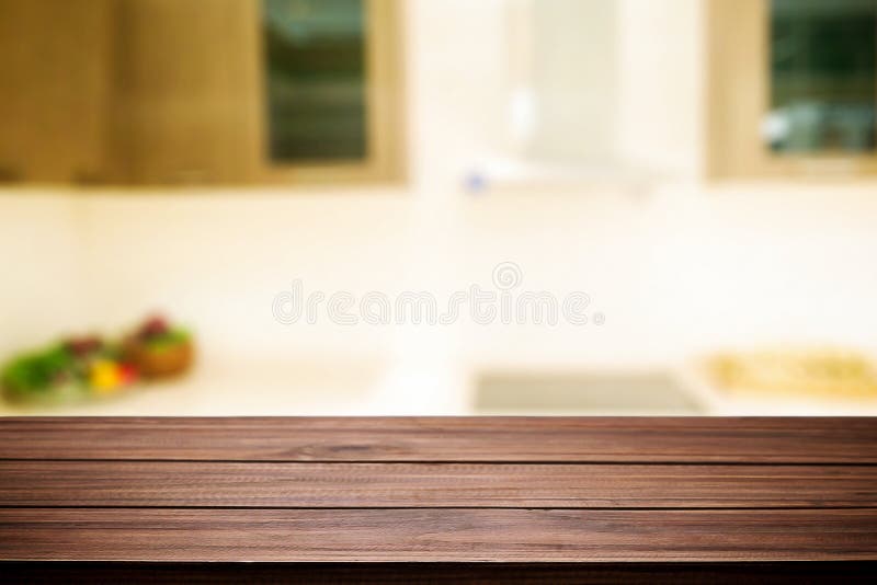 Wood Desk Space And Blurred Of Kitchen Background. For Product D Stock