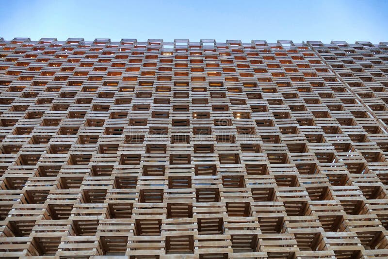 Wood facade build geometric pattern perspective view from below on blue sky royalty free stock image Wood facade build geometric pattern perspective view from below on blue sky royalty free stock image