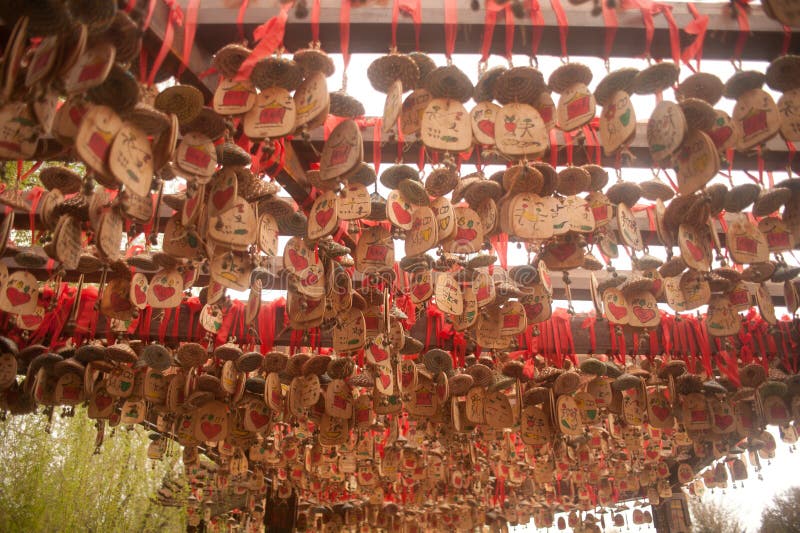 Wood of love hanging on pole in Shuhe ancient town.