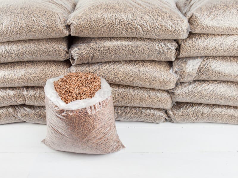 Wood pellets in bags stock image. Image of store, energy - 42328677