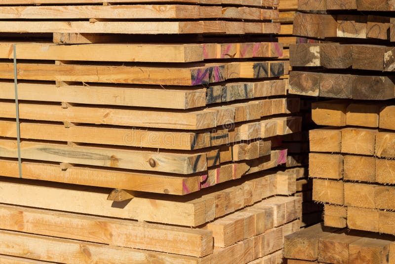 Wood Planks for Sale. Stacks of Processed Wood at the Timber Yard Stock