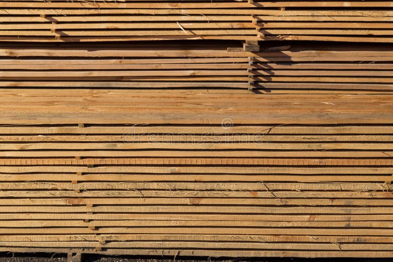 Wood Planks for Sale. Stacks of Processed Wood at the Timber Yard Stock