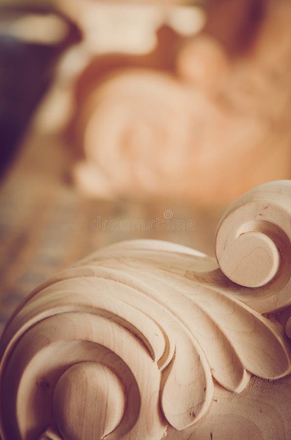 Wood processing. Joinery work. wood carving. the carving element. close up. small depth of field.instagram toning effect. use as b royalty free stock photos Wood processing. Joinery work. wood carving. the carving element. close up. small depth of field.instagram toning effect. use as b royalty free stock photos