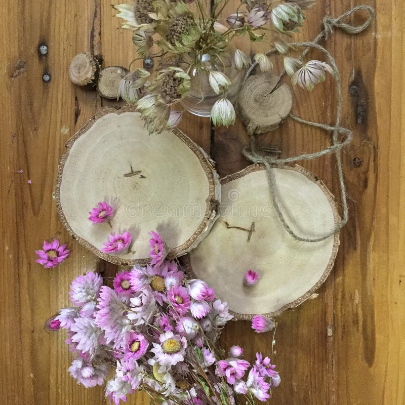 Wood Slice with Dried Pink Flowers for Decor on Wooden Background. Rough  Cut of Tree Stock Image - Image of detail, round: 181424095