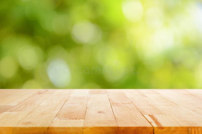 Wood table top on bokeh abstract nature green background. Wood table top on bokeh abstract nature green background