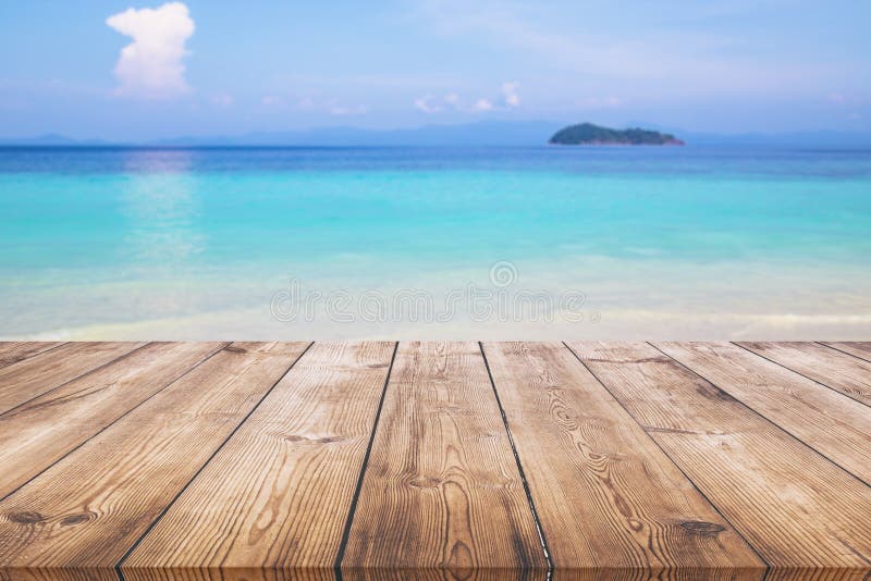Wood table with blue sea and sand beach background stock image Wood table with blue sea and sand beach background stock image