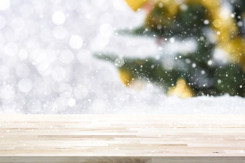 Wood table top on blur Christmas tree background royalty free stock image Wood table top on blur Christmas tree background royalty free stock image