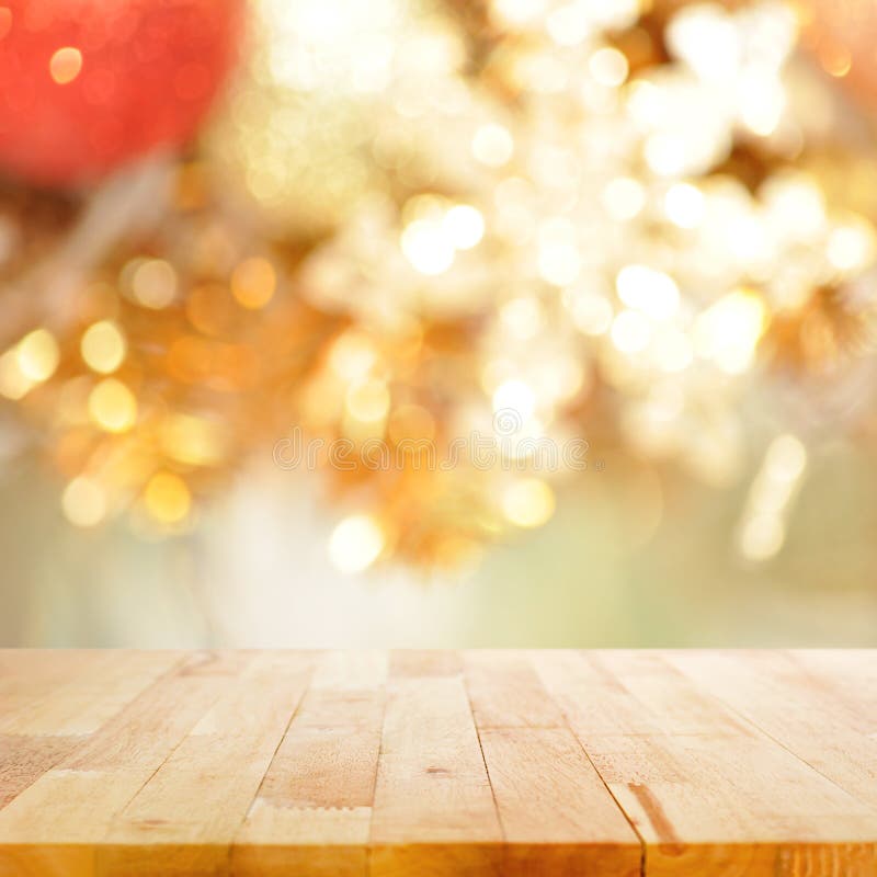 Wood table top on blurry gold background - festive background royalty free stock photos