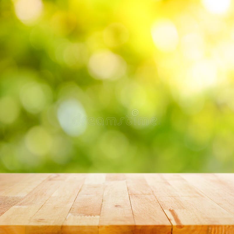 Wood table top on green bokeh abstract background royalty free stock photos