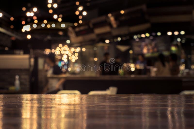 Wood Table Top with Reflect on Blur of Lighting in Cafe,restaurant ...