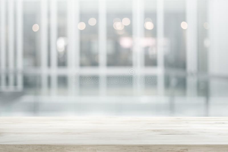 Wood table top on white abstract background form office building