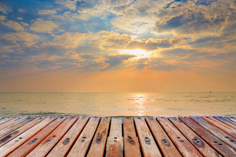 Wood Terrace on The Beach with Sunset background