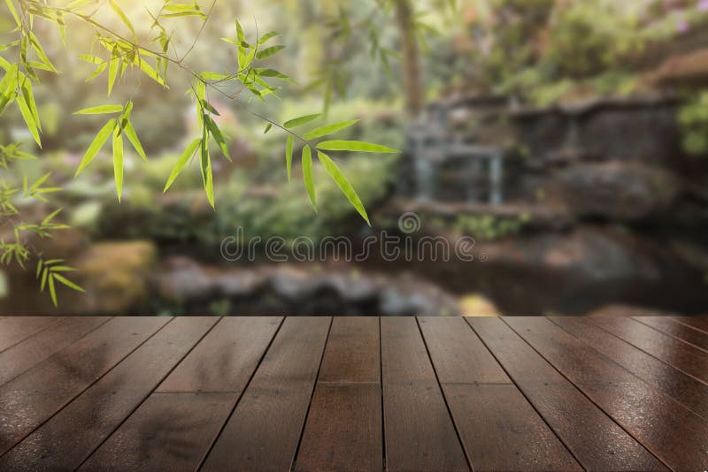 Wood terrace with beautiful waterfall background with free copy space stock image Wood terrace with beautiful waterfall background with free copy space stock image