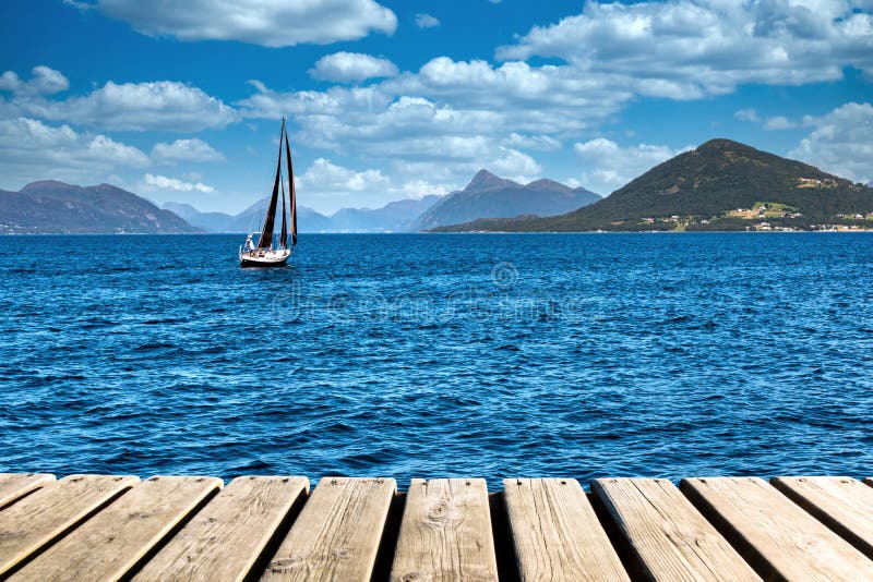 Wood Texture and Beautiful Summer Landscape Background with Norwegian Fjord, Mountains and A Sailboat stock photography Wood Texture and Beautiful Summer Landscape Background with Norwegian Fjord, Mountains and A Sailboat stock photography
