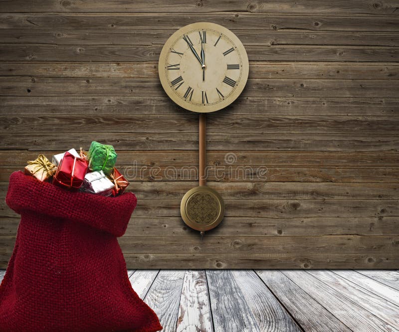 wood wall with a clock showing the time is five minutes to twelve