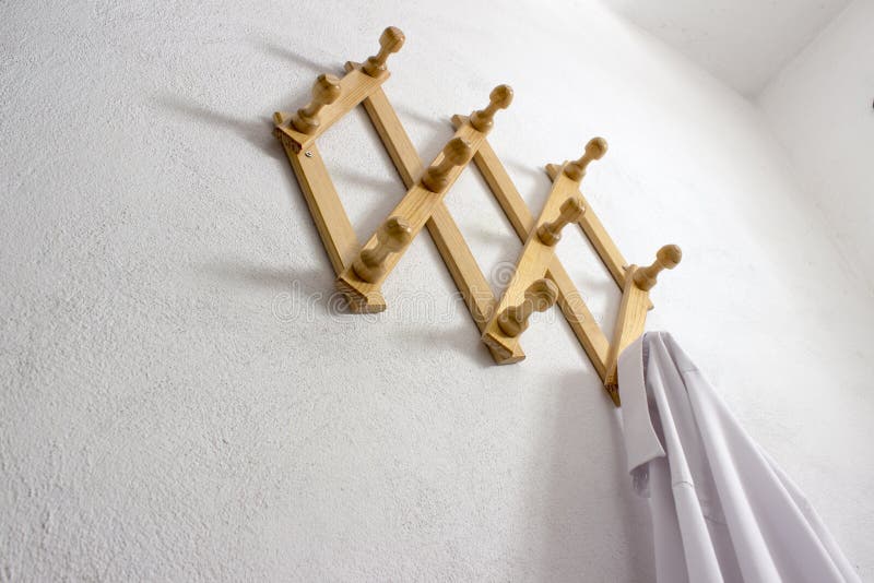 Wood wall cloth hanger with one white shirt
