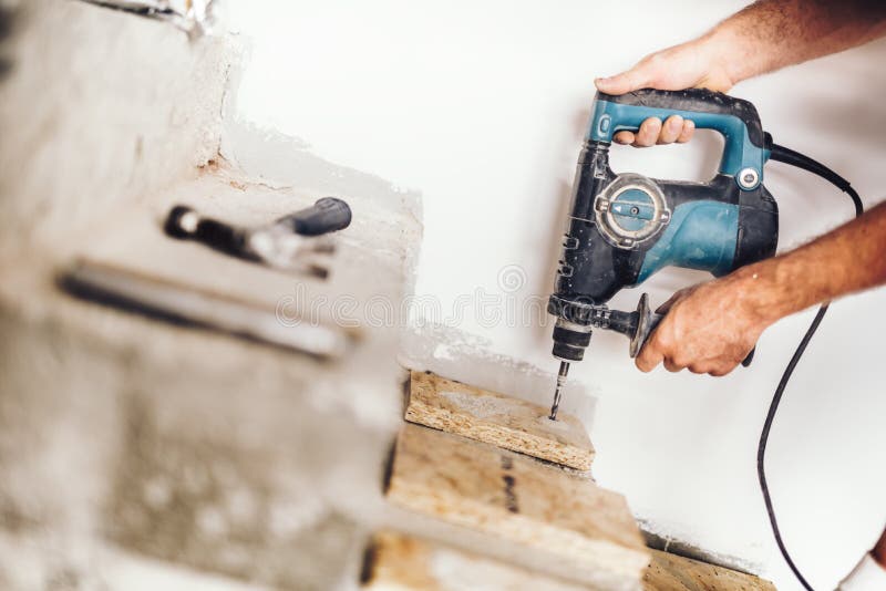 Wood Worker Using Professional Drill Press for Making Holes in Wood