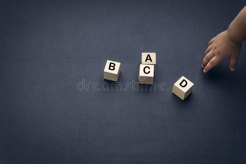 Wooden Alphabet Cube with Words ABCD Closeup and Children Hands on Black  Background Stock Photo - Image of hands, game: 170008066
