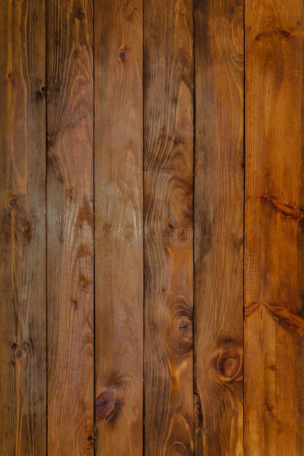 Wooden background of pine-covered boards varnished