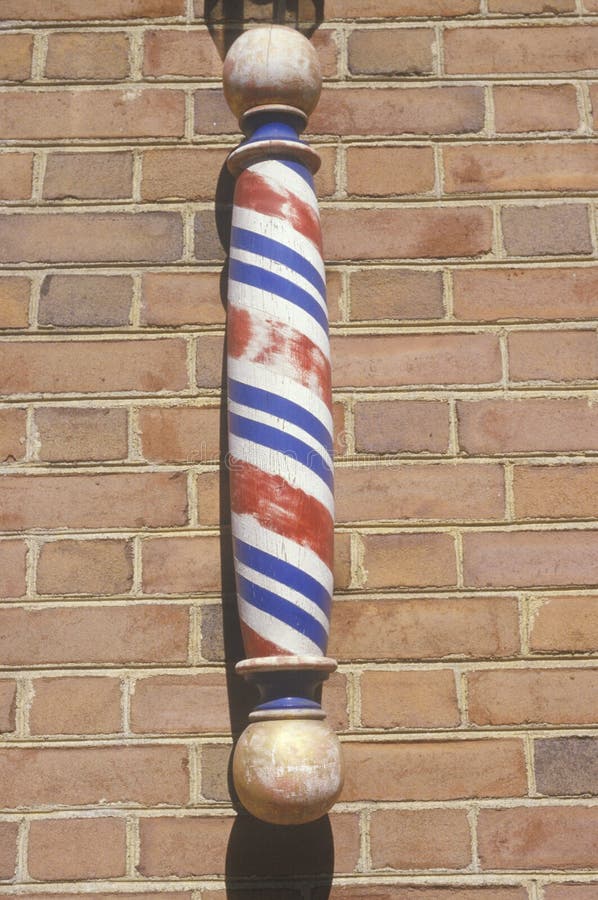 A Wooden Barber Pole on Brick Wall Stock Image Image of swirl