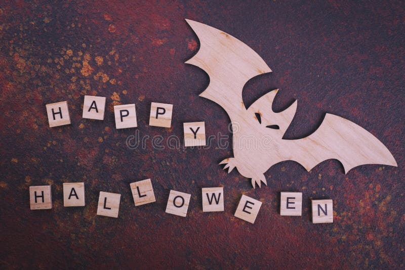 Wooden bat, text Happy Halloween stock photography Wooden bat, text Happy Halloween stock photography