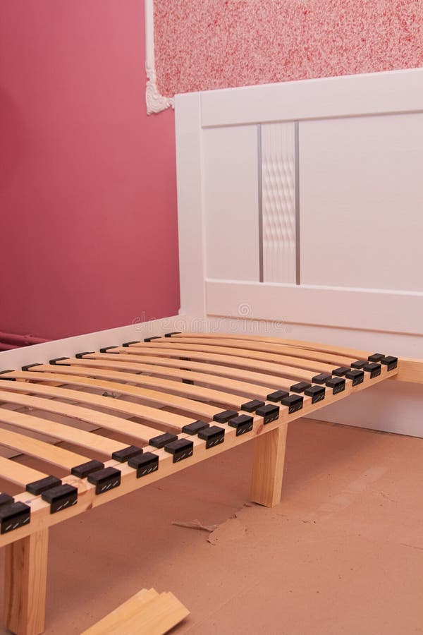 Wooden Bed Frame,part of the Bed Frame Housing when Assembled in a Room