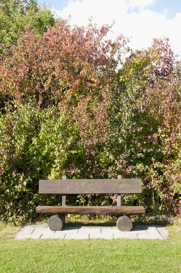 A Wooden Bench at a Golf Course in Autumn, Germany royalty free stock photo