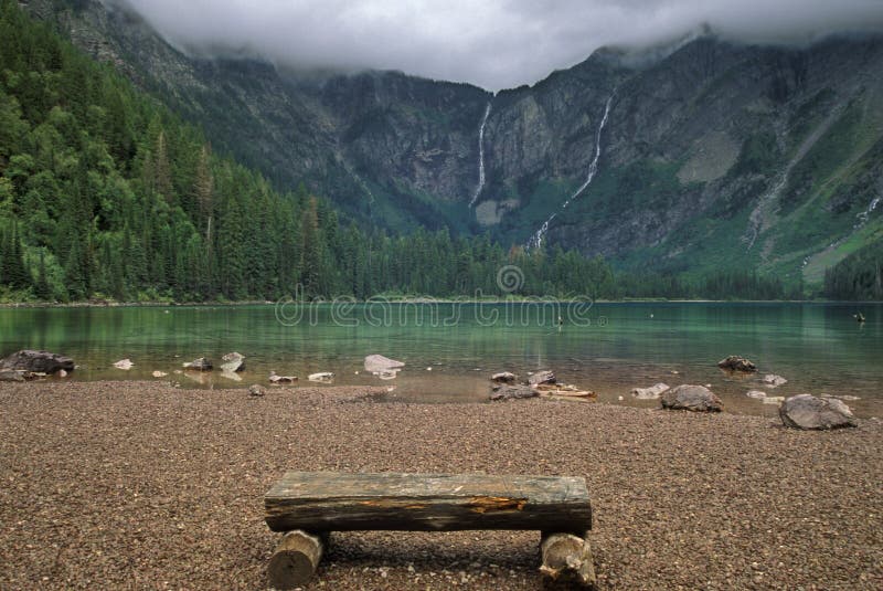 Wooden Bench Near a Mountain Lake