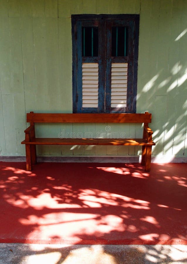 Wooden bench and old window