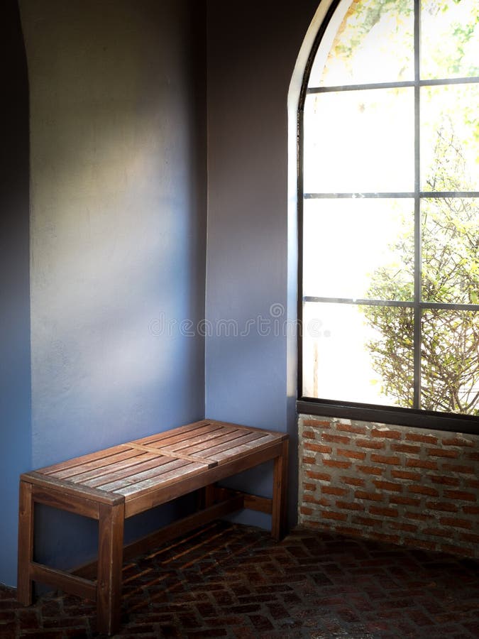 Wooden bench in room with Shine of light to window stock image Wooden bench in room with Shine of light to window stock image