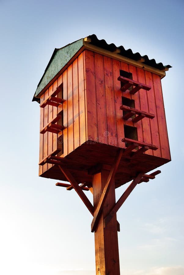 Wooden Birdhouse on a Wooden Post in the Outdoors Stock Image Image