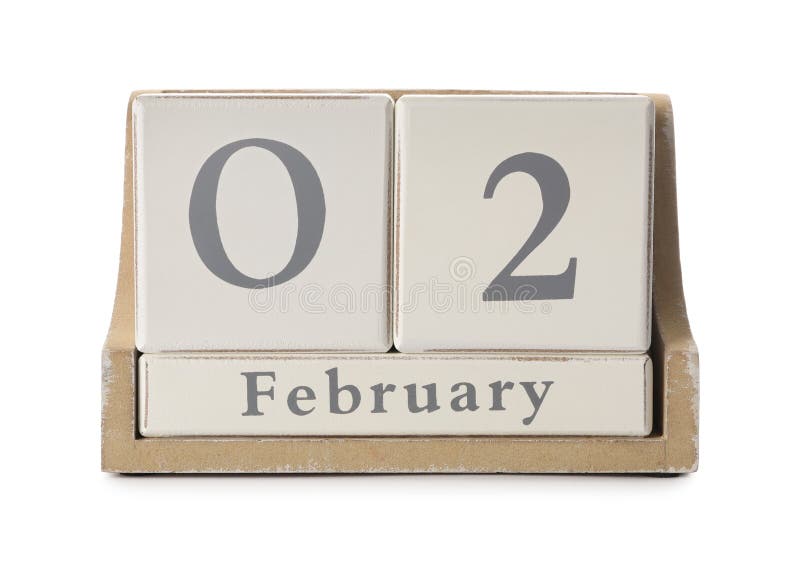 Wooden block calendar with date February 2nd on white background. Groundhog day