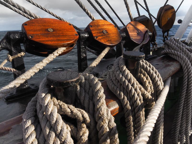 Closeup of wooden blocks and lines on traditional tallship. Closeup of wooden blocks and lines on traditional tallship