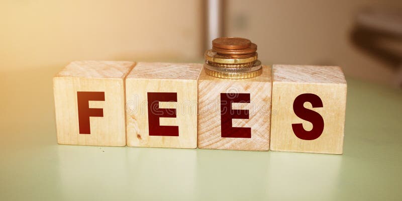 Wooden Blocks with the text: Fees. Taxation and penalties business accounting finacial concept stock photos Wooden Blocks with the text: Fees. Taxation and penalties business accounting finacial concept stock photos