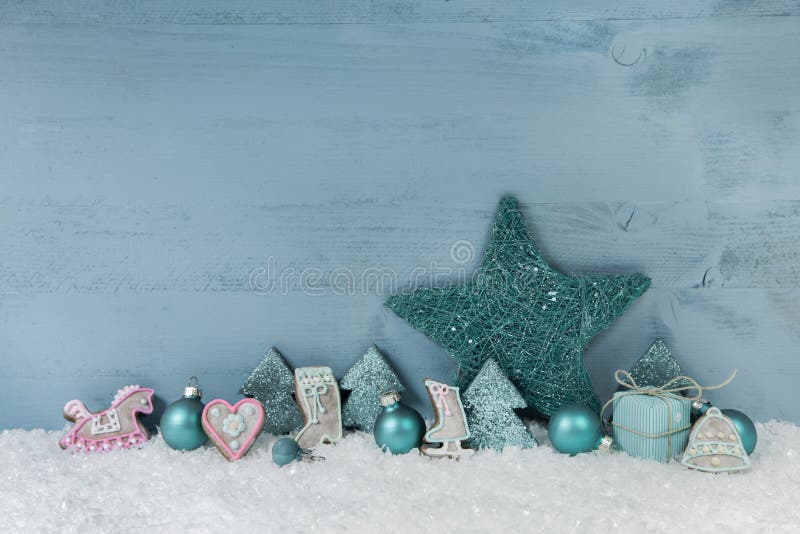 Wooden blue or mint green christmas background with decoration.