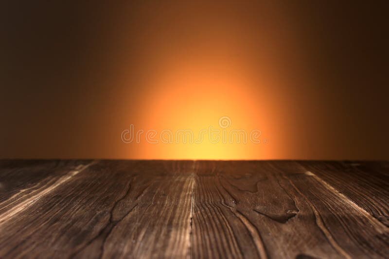 Wooden board empty table in front of blurred lighting background. Mock up for display of product. Shallow depth of field royalty free stock images