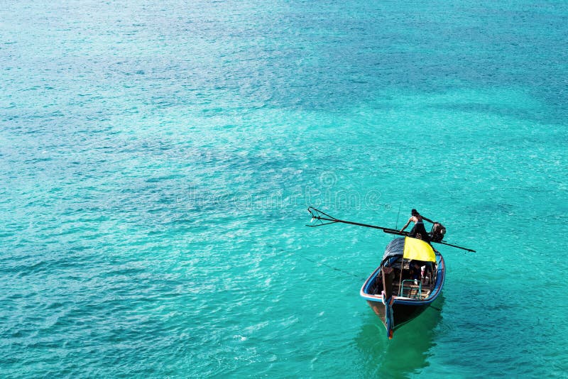 Wooden boat on beautiful ocean in Lipe island, Thailand