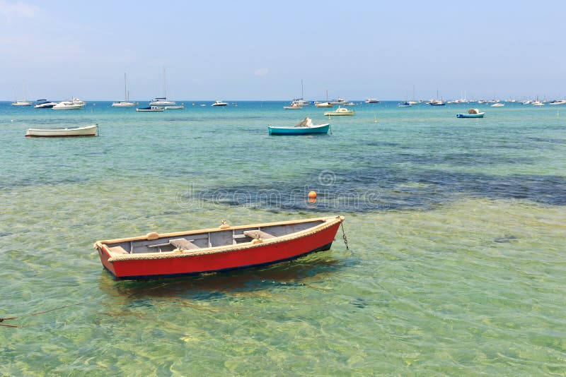 Wooden boat in shallow water stock image